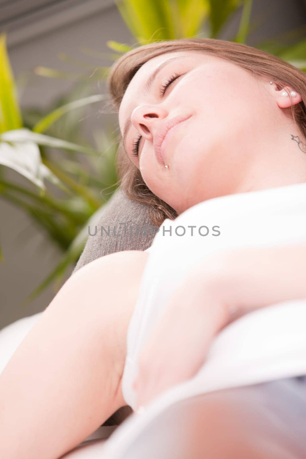 girl sleeping on her sofa like a little baby