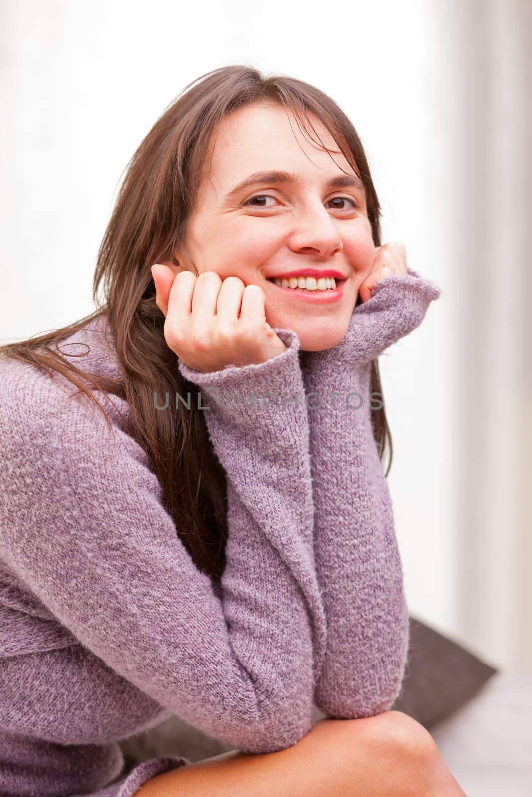 satisfied self-confident woman smiles to the camera