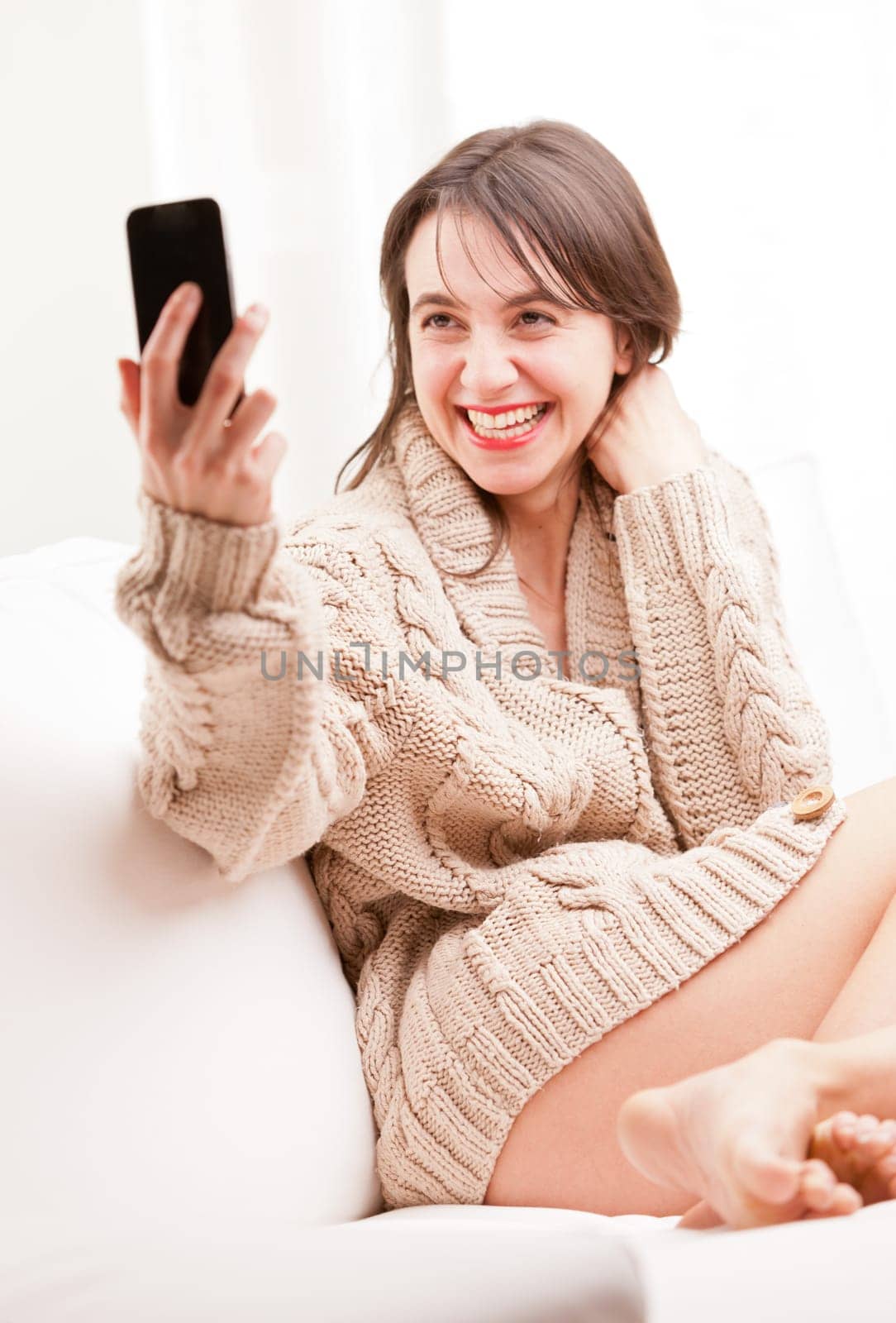 young woman making herself a selfie with her mobile telephone