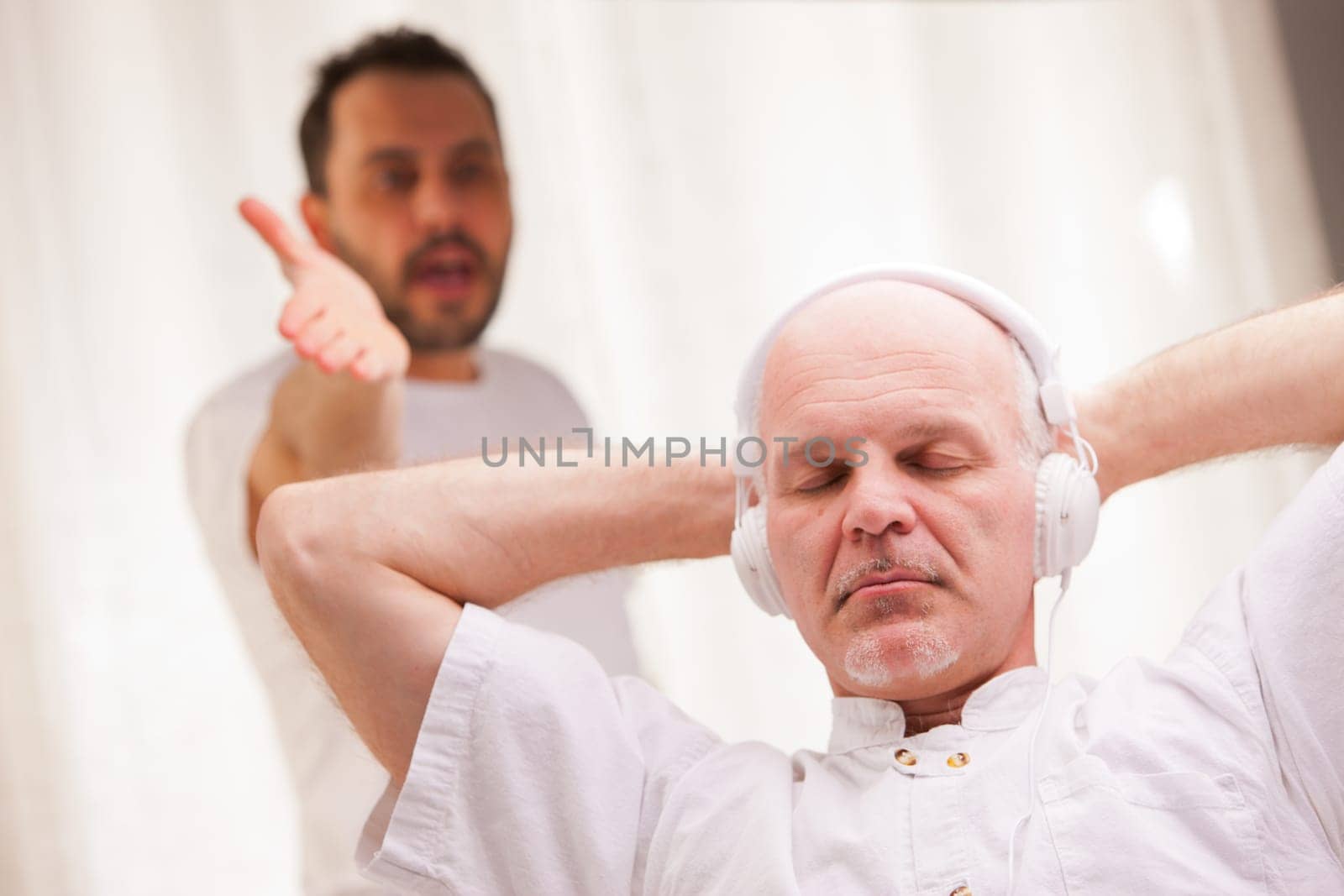 one friend complains to the other one because he listens to music and does nothing else