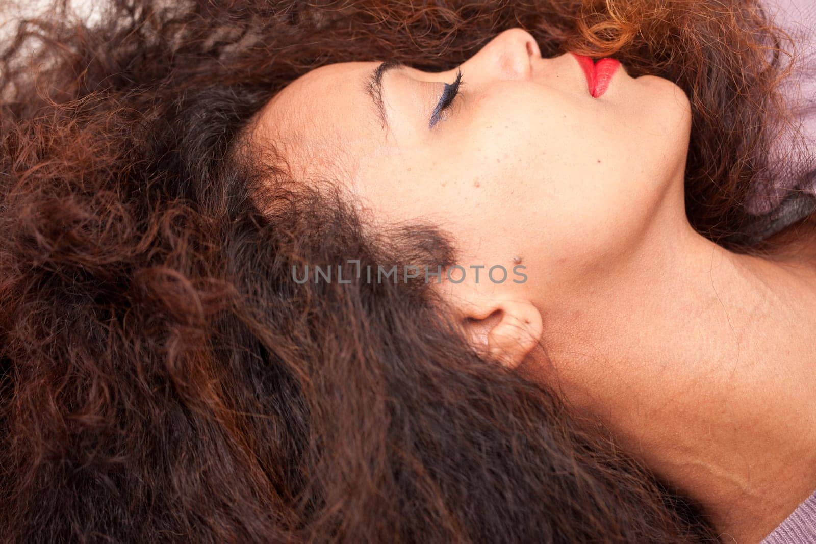 wonderful african-american woman sleeping on her sofa