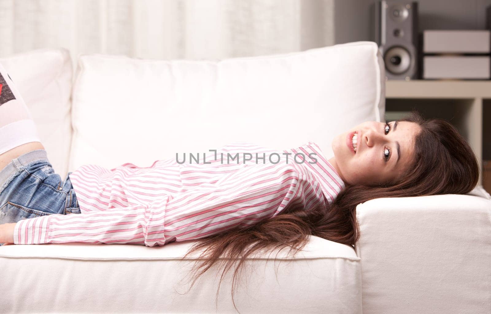 nice girl smiling on a sofa relaxed
