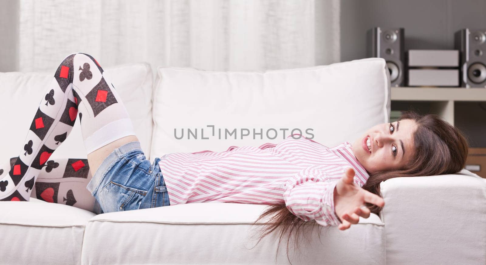 girl talking to the camera from a couch in her living room