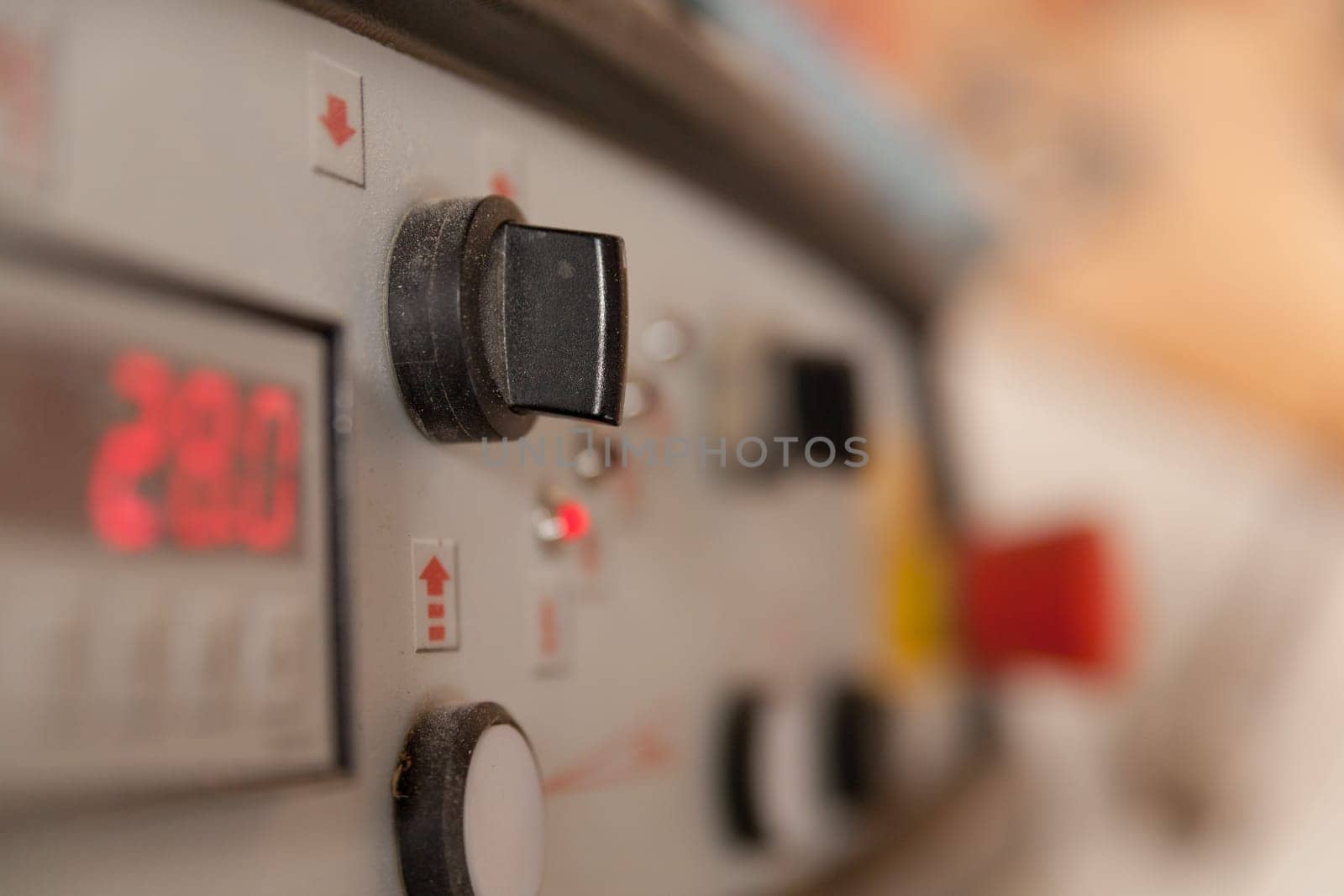 detail of a switch in a carpenter workshop with a very shallow depth of field