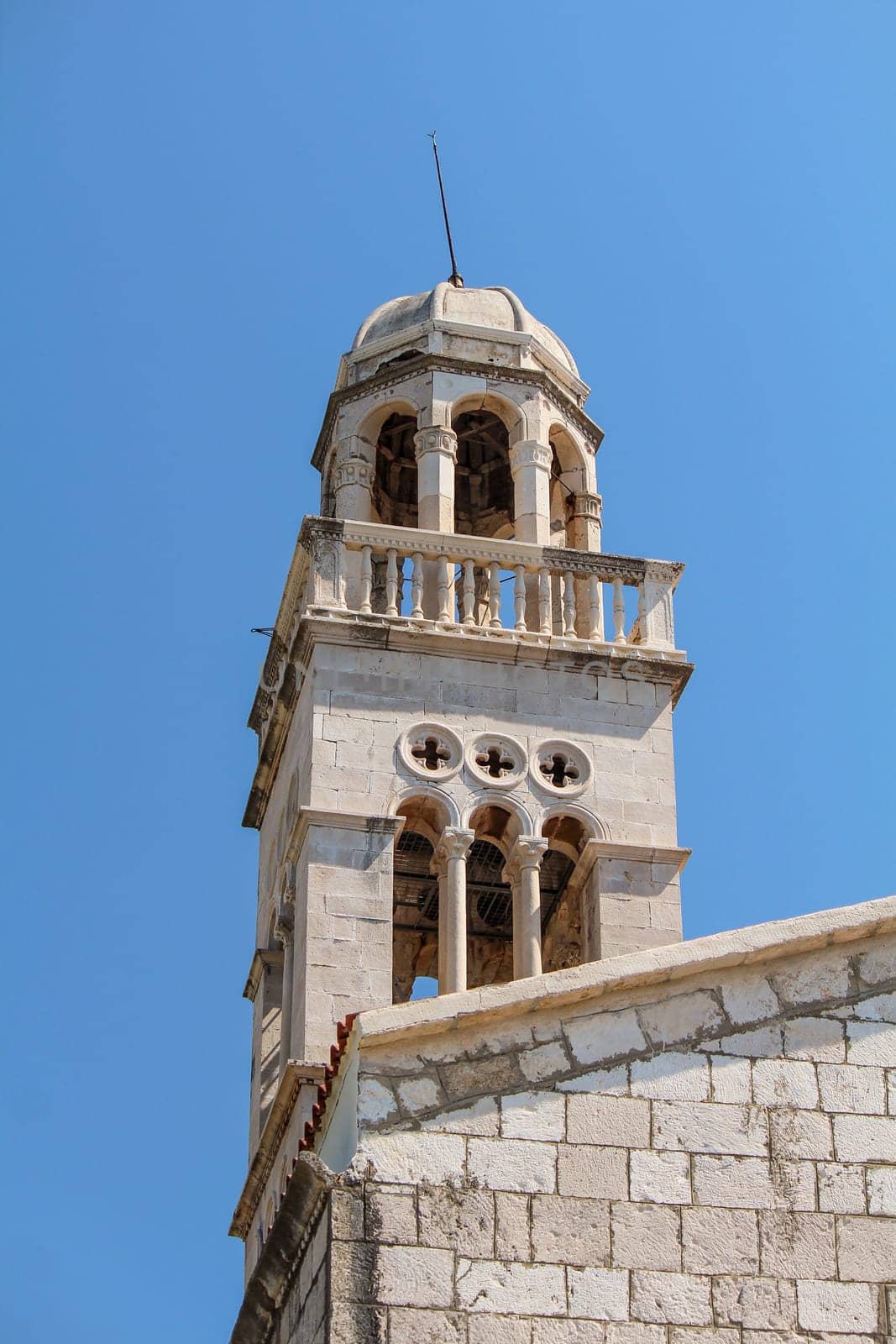 Picturesque classic bell tower of a church in Hvar, Croatia