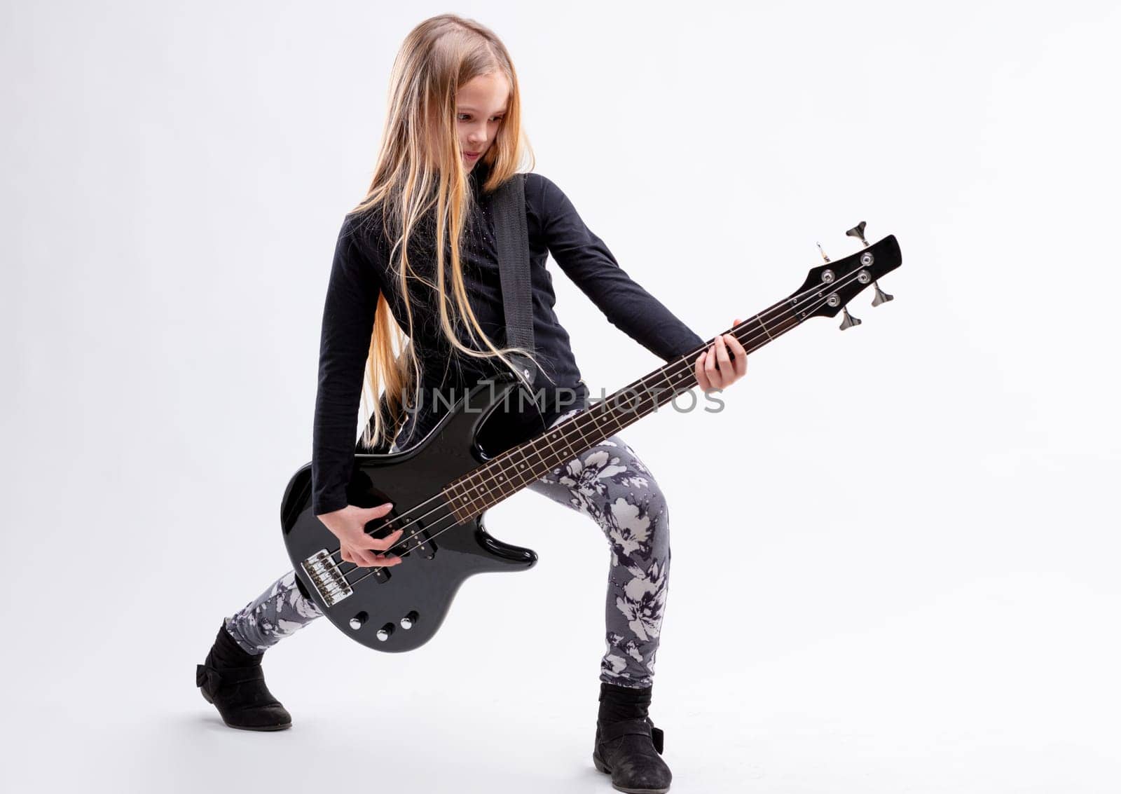 blonde long haired girl is a bass guitar metal or hard rock player