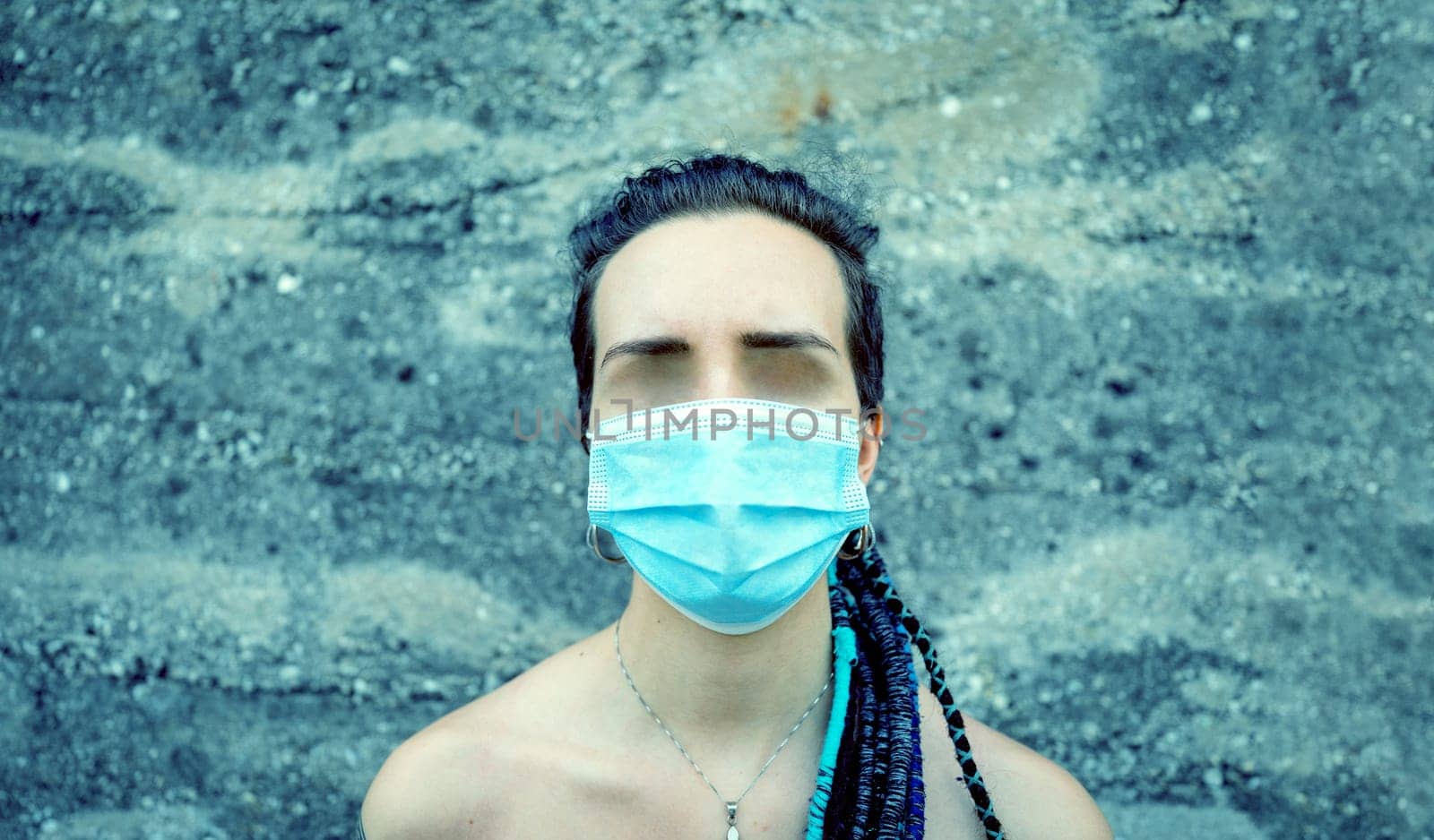feeling of loss of identity and loneliness due to the face erasure because of face masks necessary as protections against the global pandemic of Corona Virus COVID-19, concept of sensory deprivation and disorientation, feeling invisible and blind
