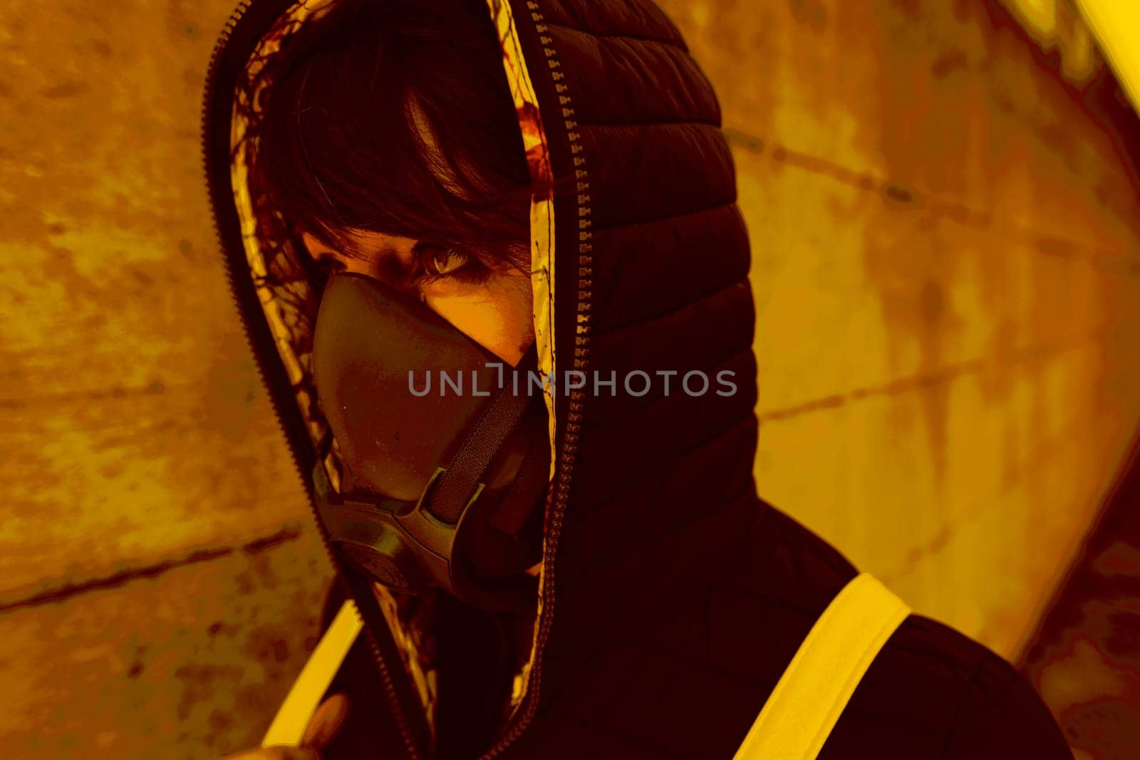 woman with a gas mask walking on the city streets surviving a corona virus pandemic or post atomic world