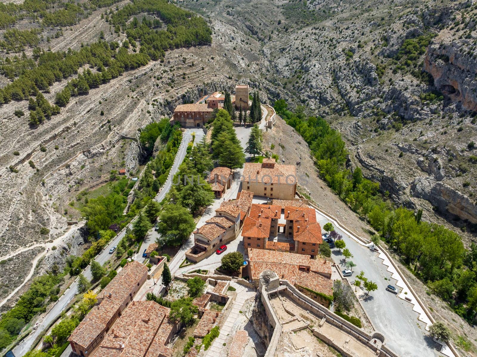 Auditorium church of Santa Maria next to the white surveillance tower in Albarracin, province of Teruel listed as beautiful towns of Spain
