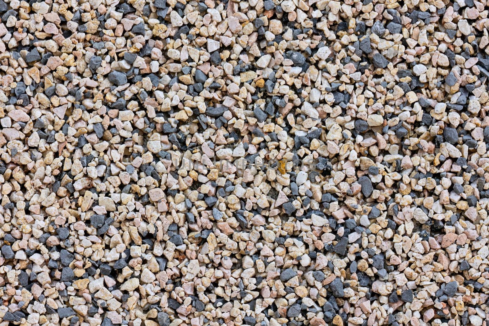 Detailed capture of small pebbles, highlighting their natural texture and intricate patterns.