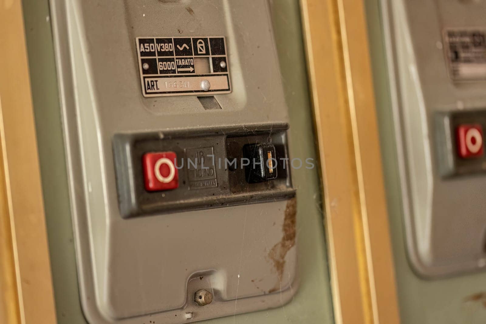 Milan, Italy 19 august 2023: Close-up of aged, obsolete high-voltage electrical switches with a nostalgic industrial feel.