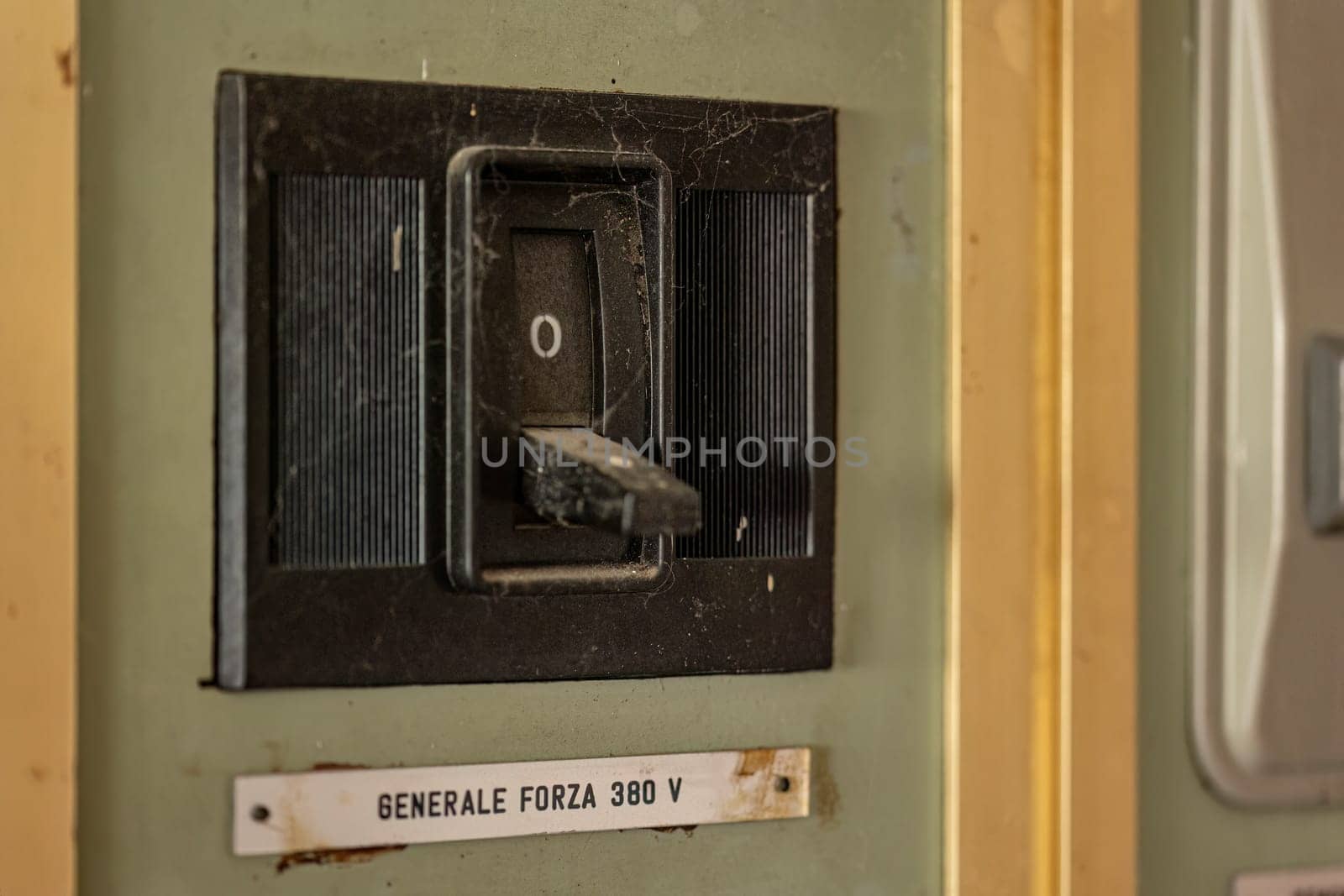 Close-up of aged, obsolete high-voltage electrical switches with a nostalgic industrial feel.
