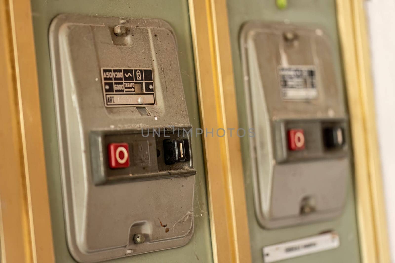 Milan, Italy 19 august 2023: Close-up of aged, obsolete high-voltage electrical switches with a nostalgic industrial feel.