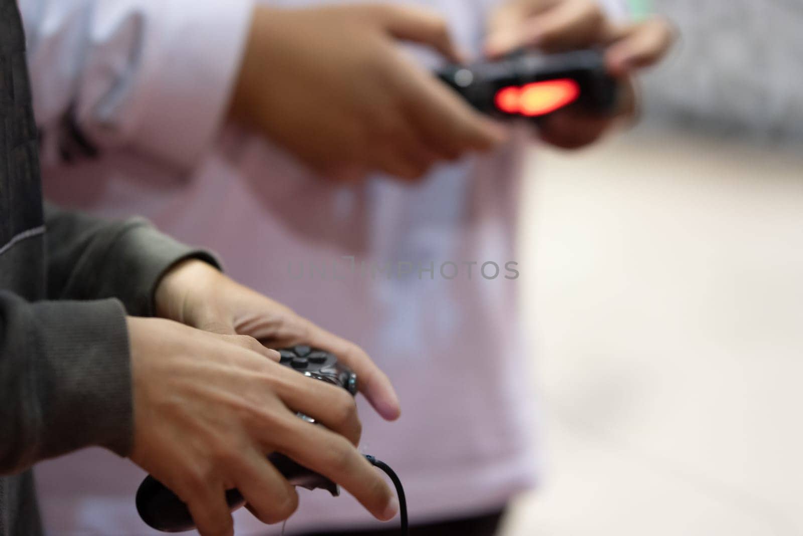Trying new console games using joysticks at game expo. Mid shot