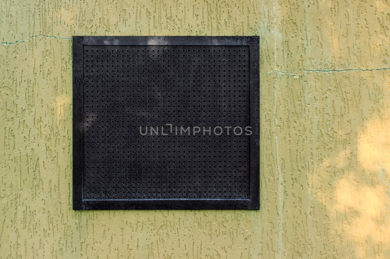Air ventilation frame on wall of the small factory.