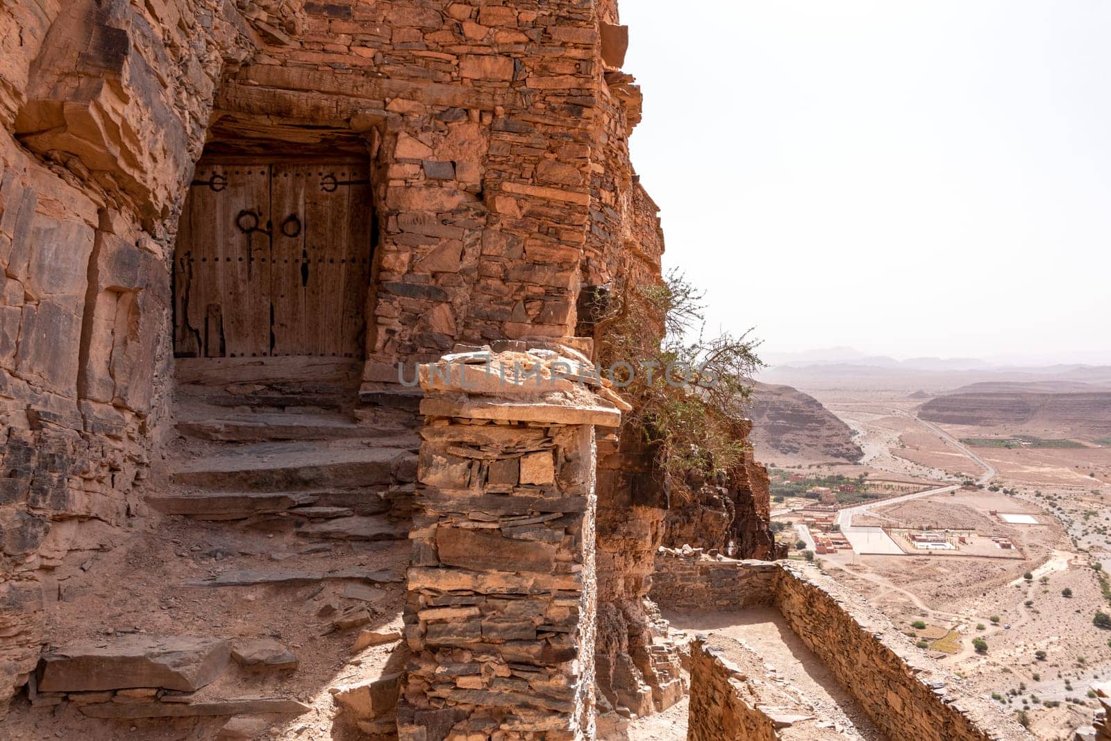 Hiking through the old Id Aissa agadir, an old granary in Amtoudi, Morocco