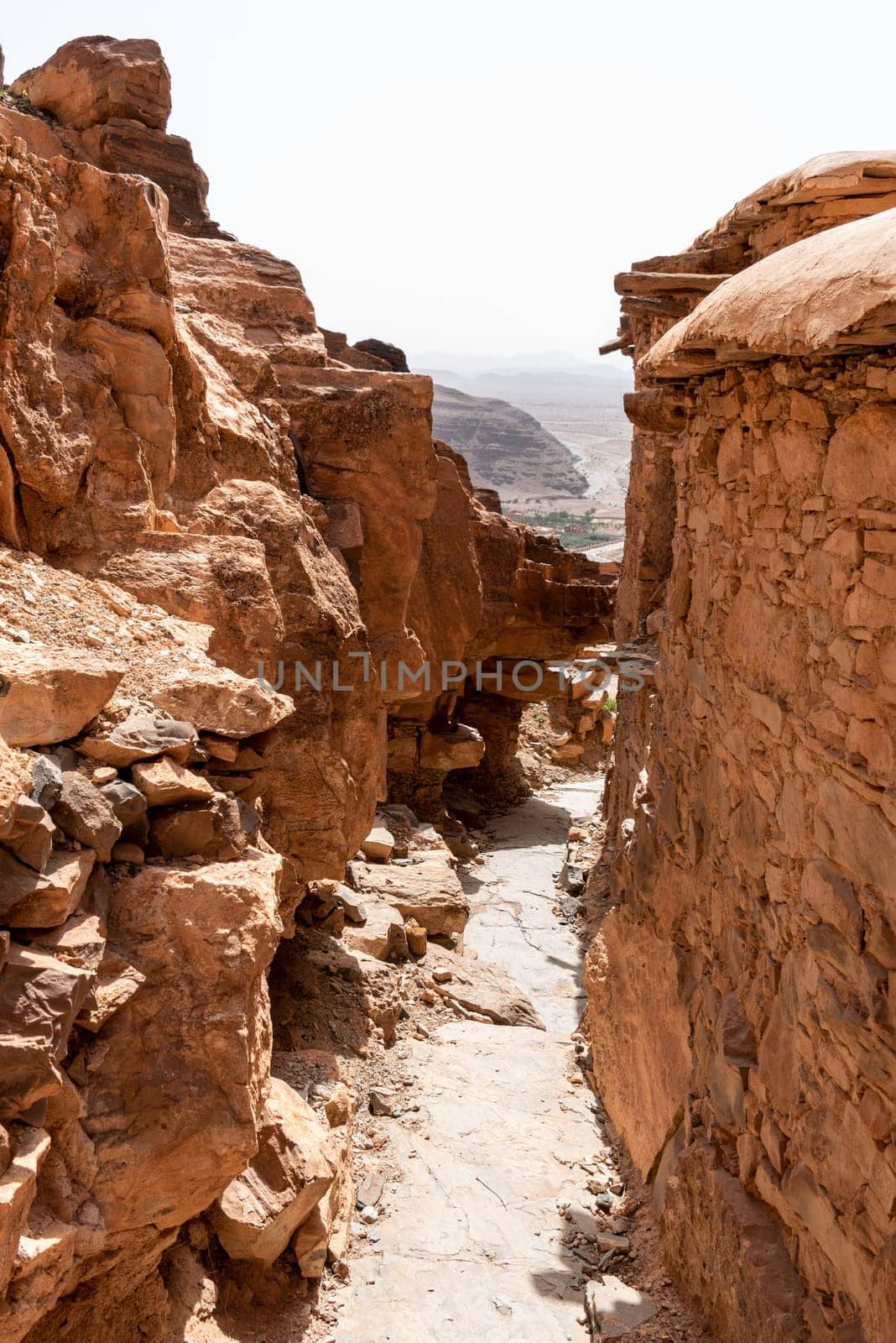 Hiking through the old Id Aissa agadir, an old granary in Amtoudi, Morocco