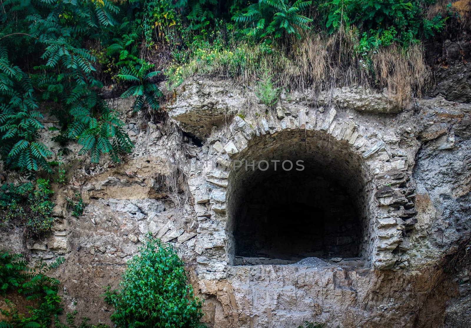 very old tunnel through mountain rock