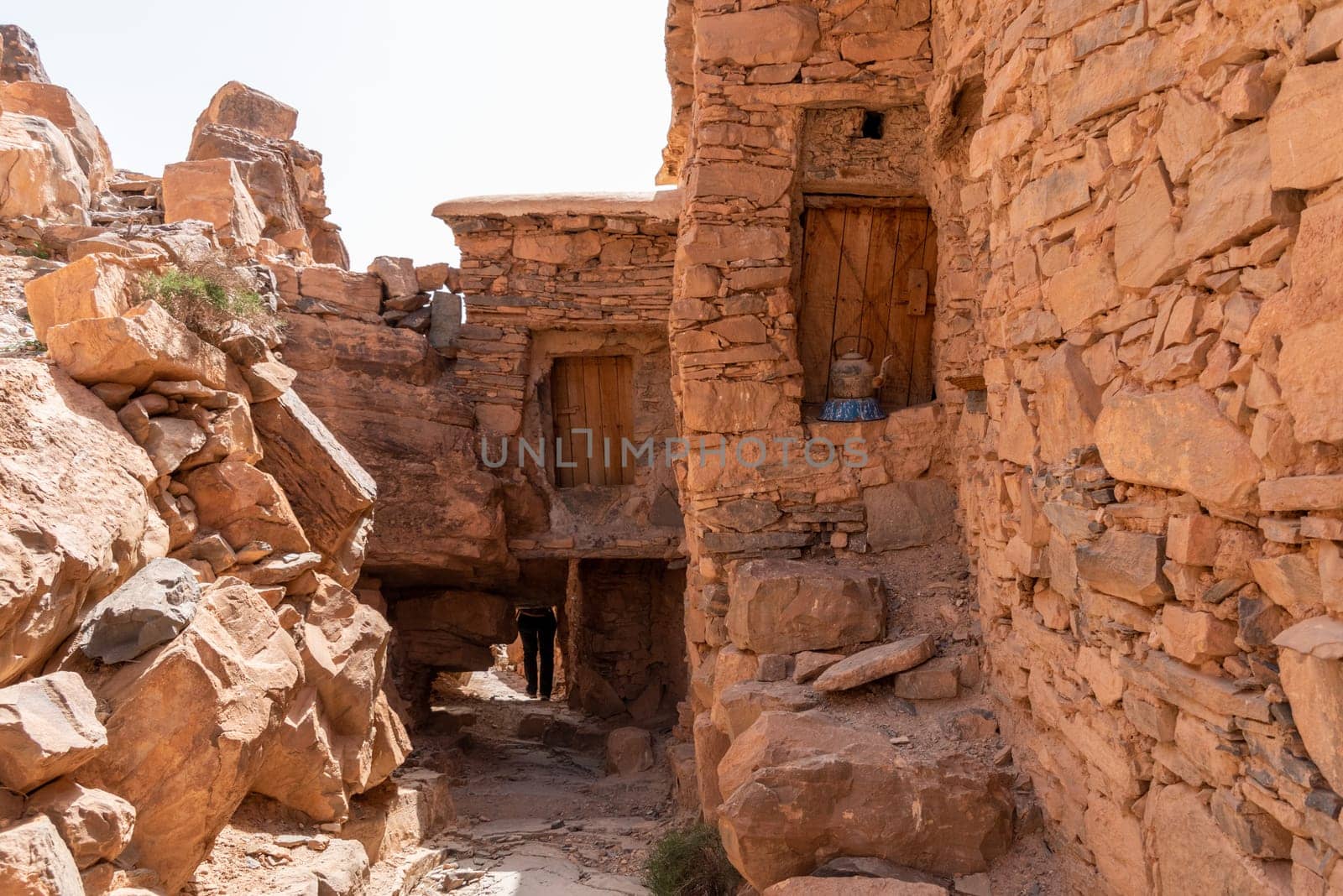 Hiking through the old Id Aissa agadir, an old granary in Amtoudi, Morocco