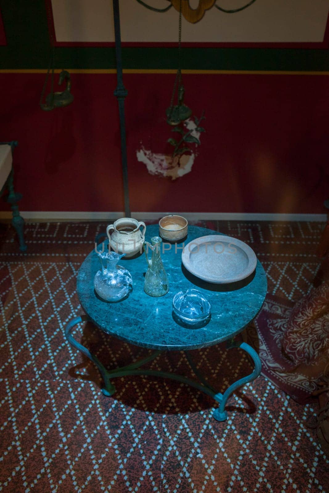 Almendralejo, Spain - Jan 26th, 2018: Roman domestic room with containers to pour wine. Wine Science Museum, Almendralejo, Spain