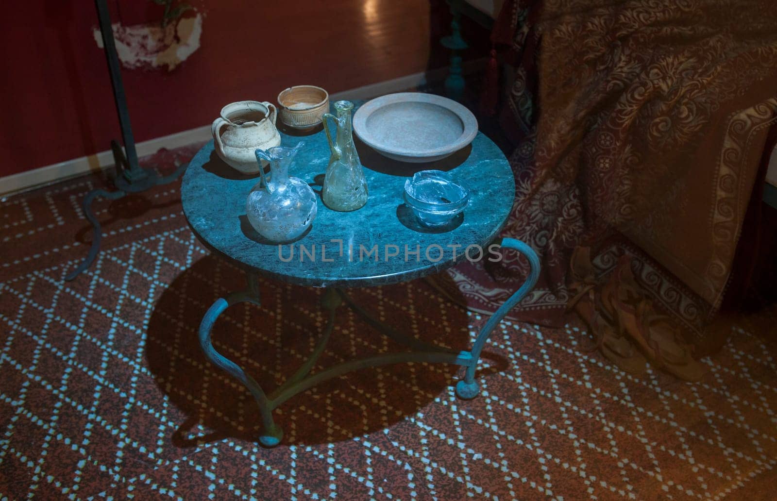 Almendralejo, Spain - Jan 26th, 2018: Roman domestic room with containers to pour wine. Wine Science Museum, Almendralejo, Spain