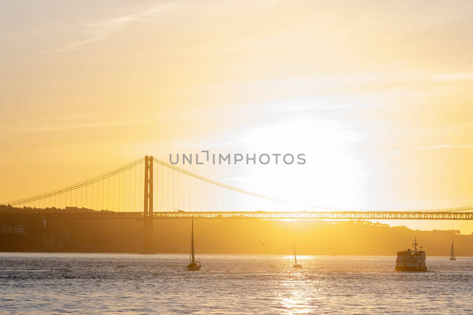 Orange sunset over the Tagus River. Mid shot