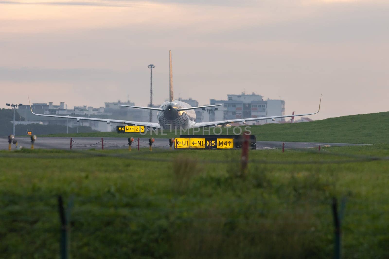 30 November 2022 PORTUGAL, LISBON: direction indicators for aircraft on the runway. Mid shot
