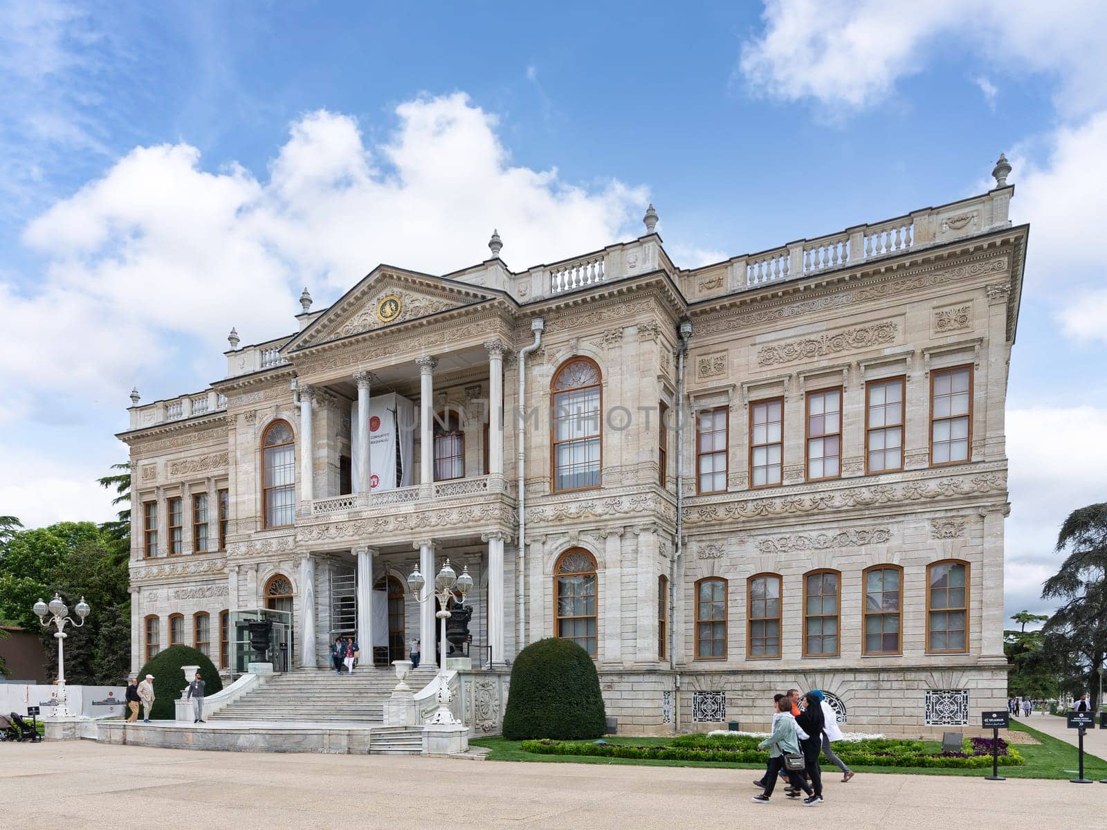 Istanbul, Turkey - May 10, 2023: Dolmabahce Palace, or Dolmabahce Sarayi, located in Besiktas district on the European coast of the Bosporus, main administrative center of the Ottoman Empire formerly