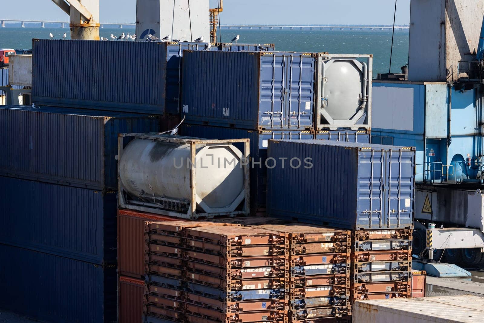 A lot of containers ready for shipping in the port. Mid shot