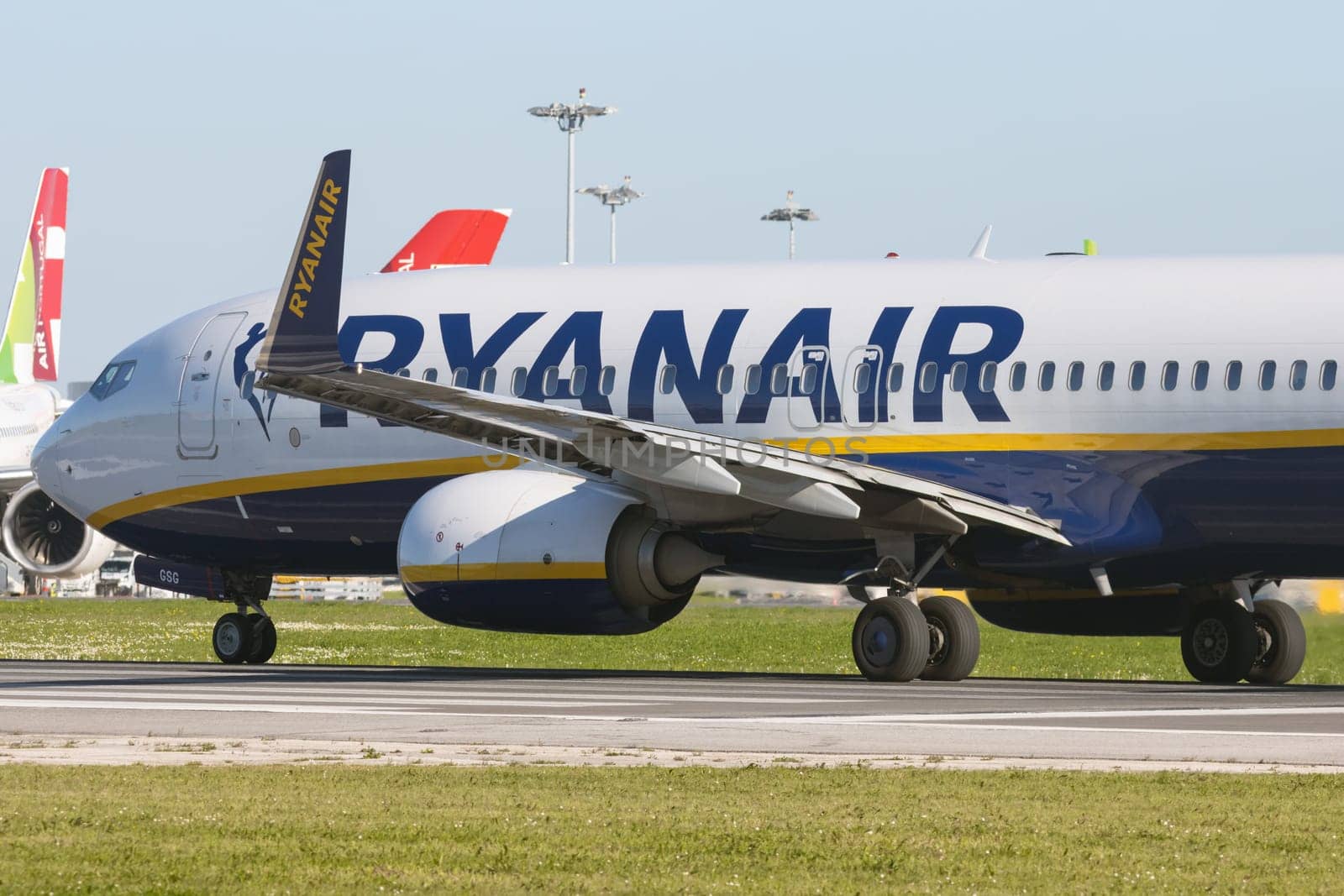 1 December 2022 PORTUGAL, LISBON: RYANAIR passenger plane rides on the runway. Mid shot