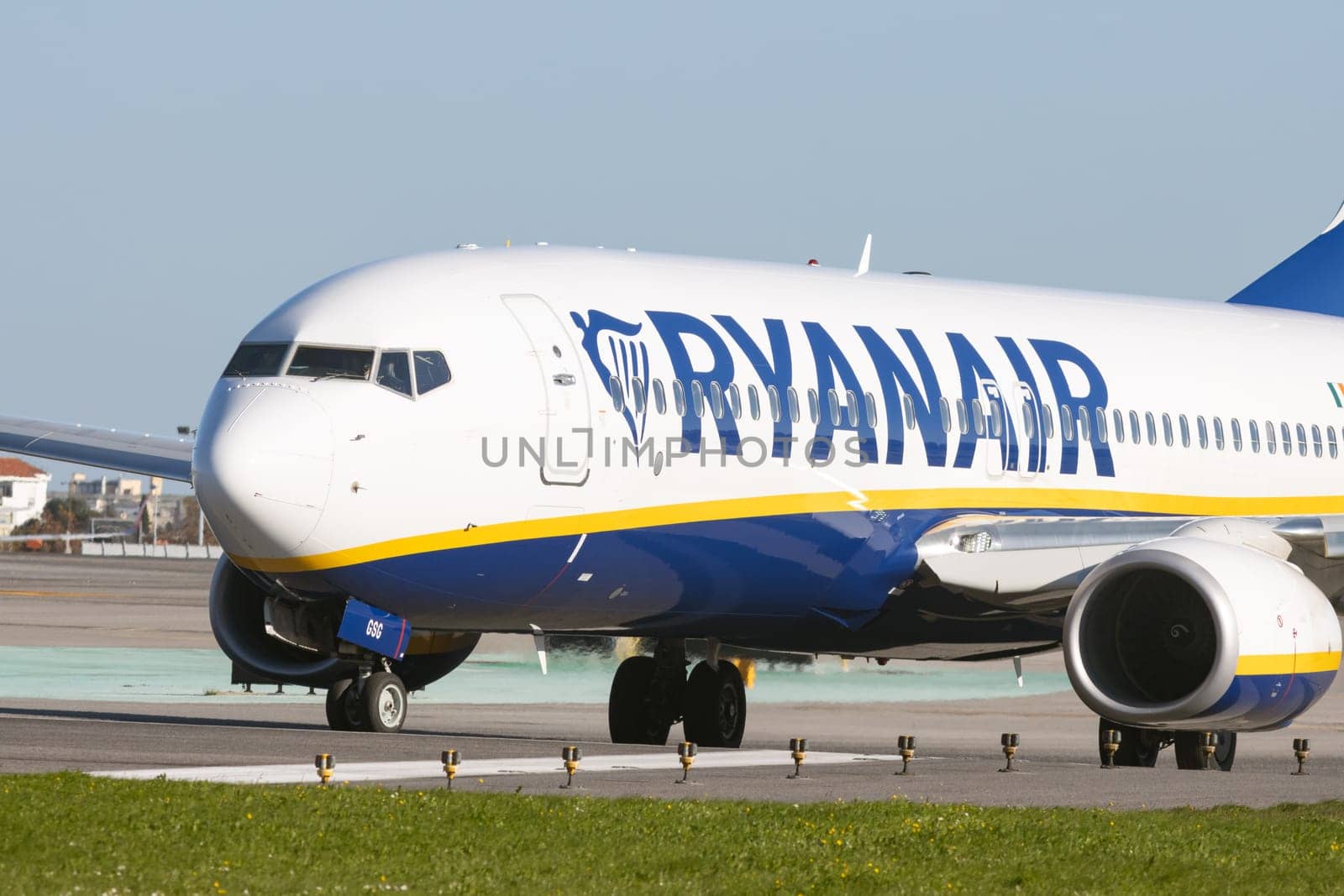 1 December 2022 PORTUGAL, LISBON: big RYANAIR passenger plane on the field. Mid shot