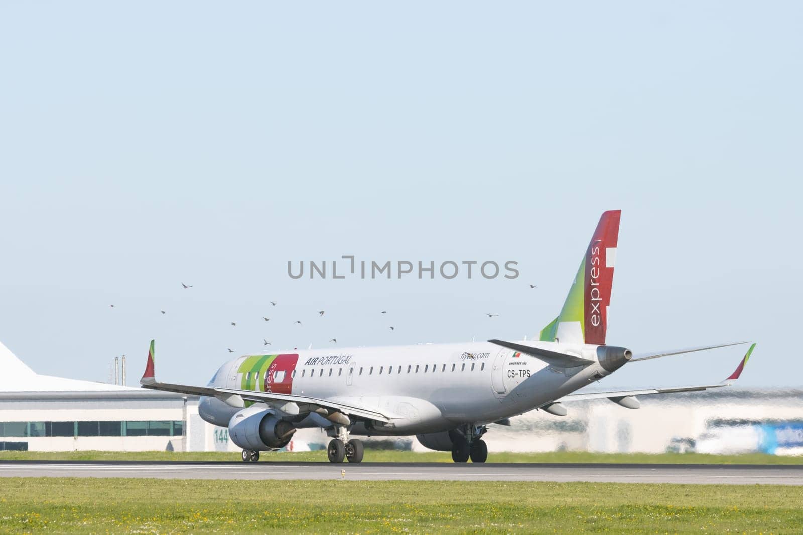 1 December 2022 PORTUGAL, LISBON: AIRPORTUGAL passenger plane riding on a runway. Mid shot