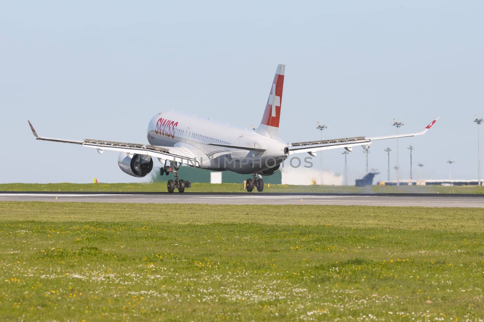 1 December 2022 PORTUGAL, LISBON: SWISS airlines passenger plane takes off the runway. Mid shot