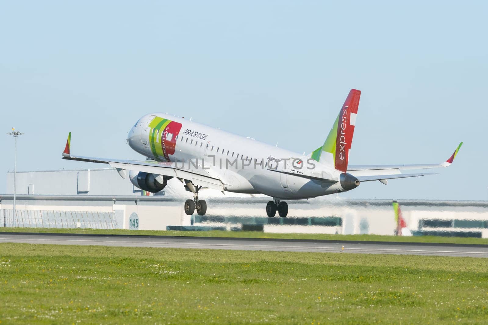 1 December 2022 PORTUGAL, LISBON: AIRPORTUGAL big passenger plane took off the runway. Mid shot