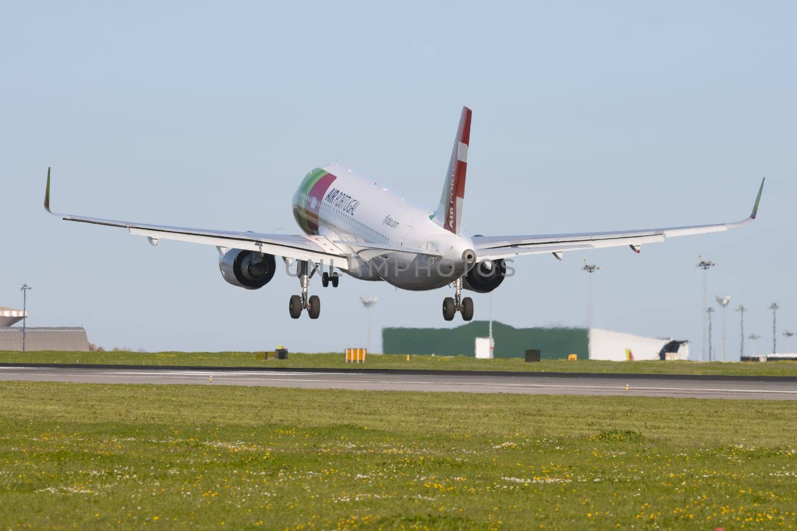 1 December 2022 PORTUGAL, LISBON: AIRPORTUGAL passenger plane takes off the runway. Mid shot