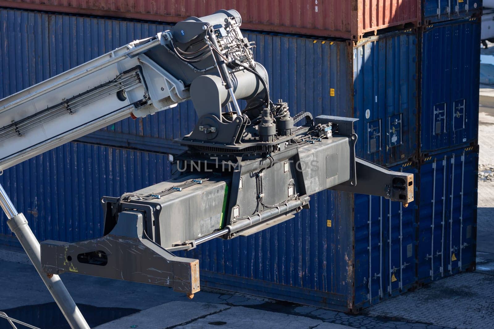 Big cargo spreader for container lifting at the port. Mid shot