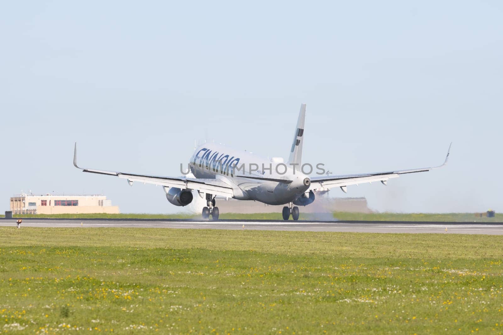 1 December 2022 PORTUGAL, LISBON: FINNAIR passenger plane takes off the runway. Mid shot