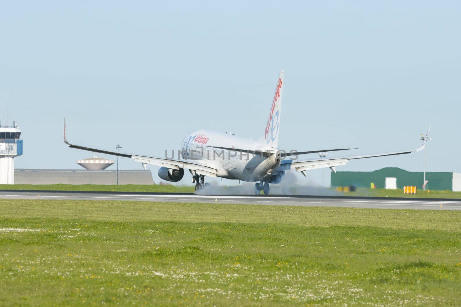 1 December 2022 PORTUGAL, LISBON: AIREUROPE airplane landed on the runway. Mid shot