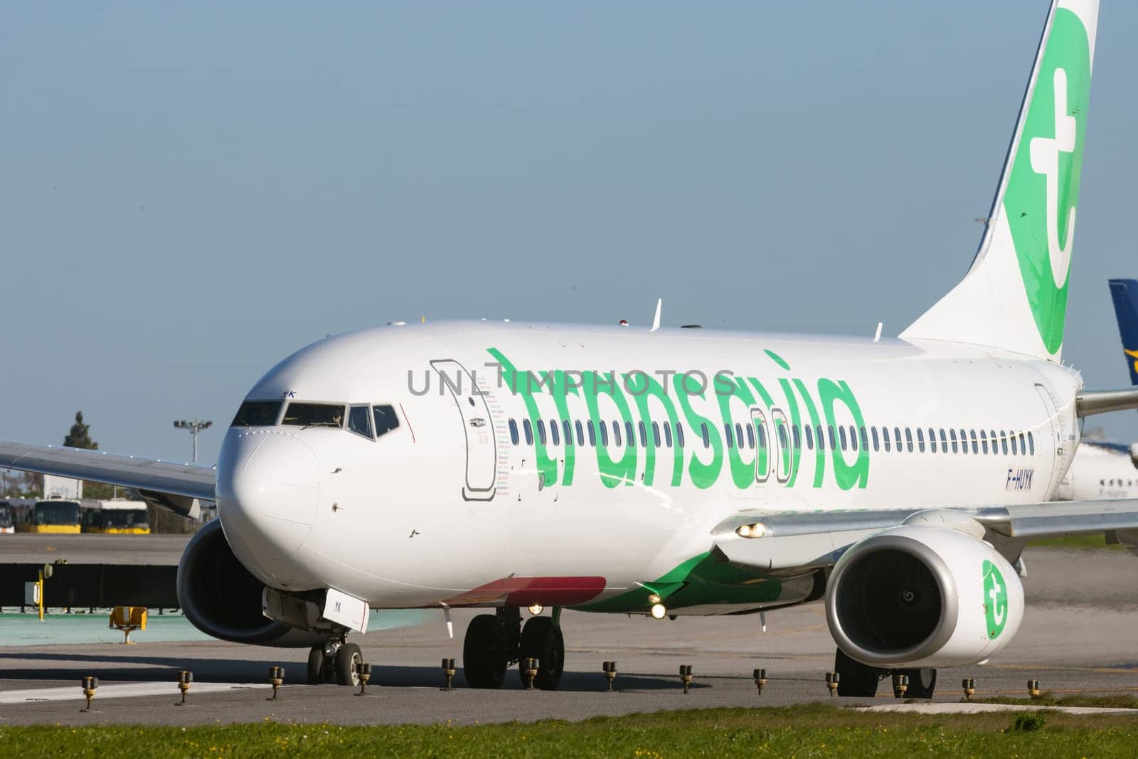 1 December 2022 PORTUGAL, LISBON: TRANSAVIA passenger plane on the field. Mid shot