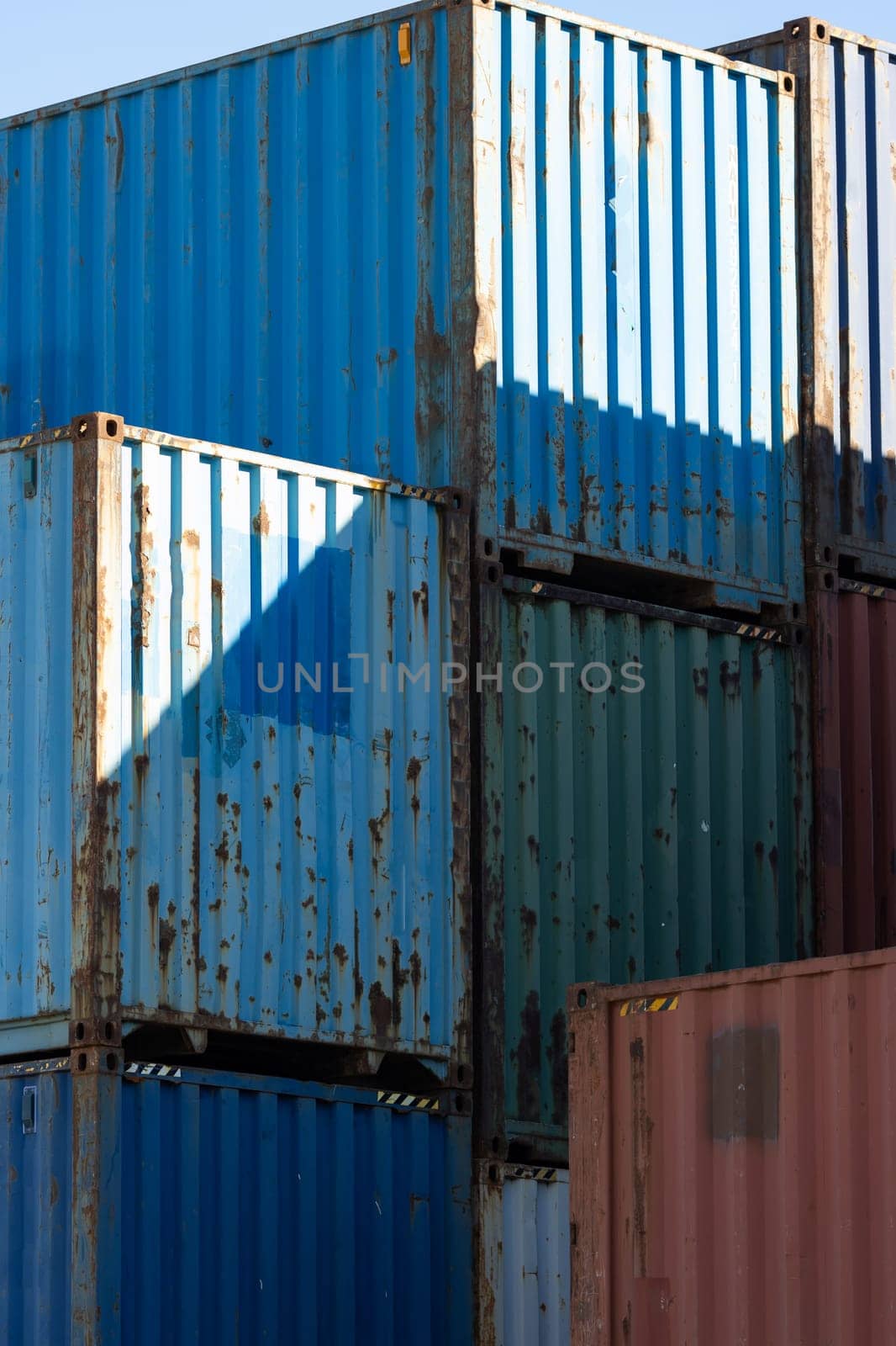 Slightly rusty industrial containers ready for shipping. Mid shot