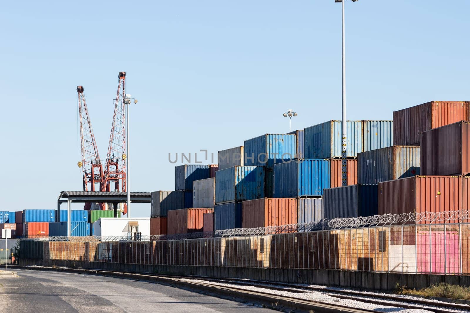 Many colorful cargo containers in the seaport. Mid shot