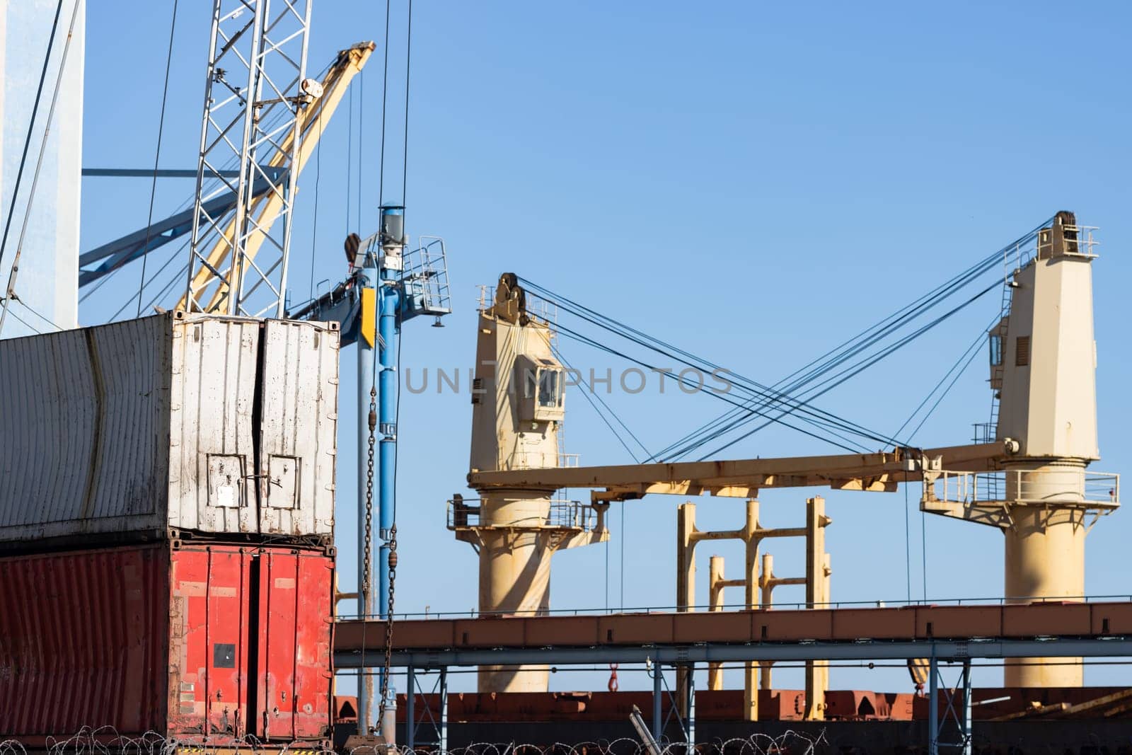Seaport and cargo containers under the blue sky. Mid shot