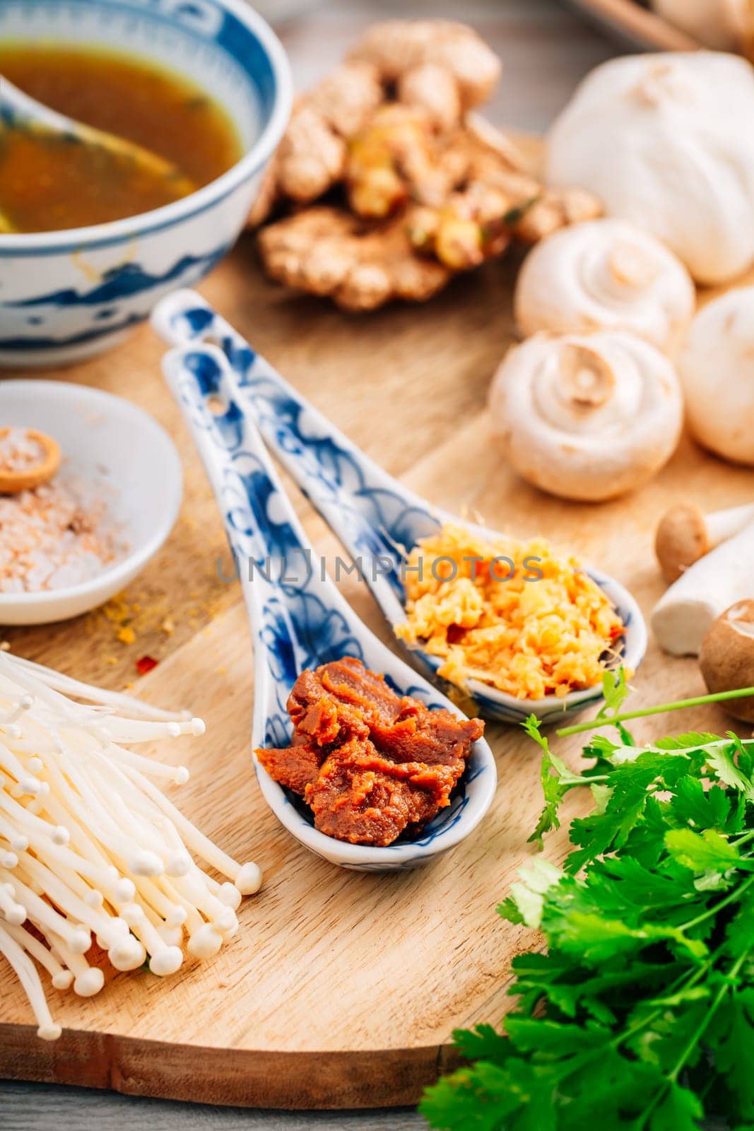 Miso paste and ginger garlic paste for miso or ramen soup on wooden background