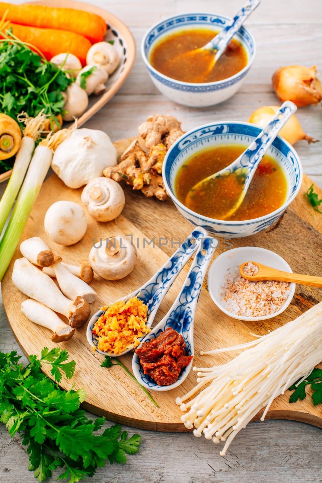Miso paste and ginger garlic paste for miso or ramen soup on wooden background