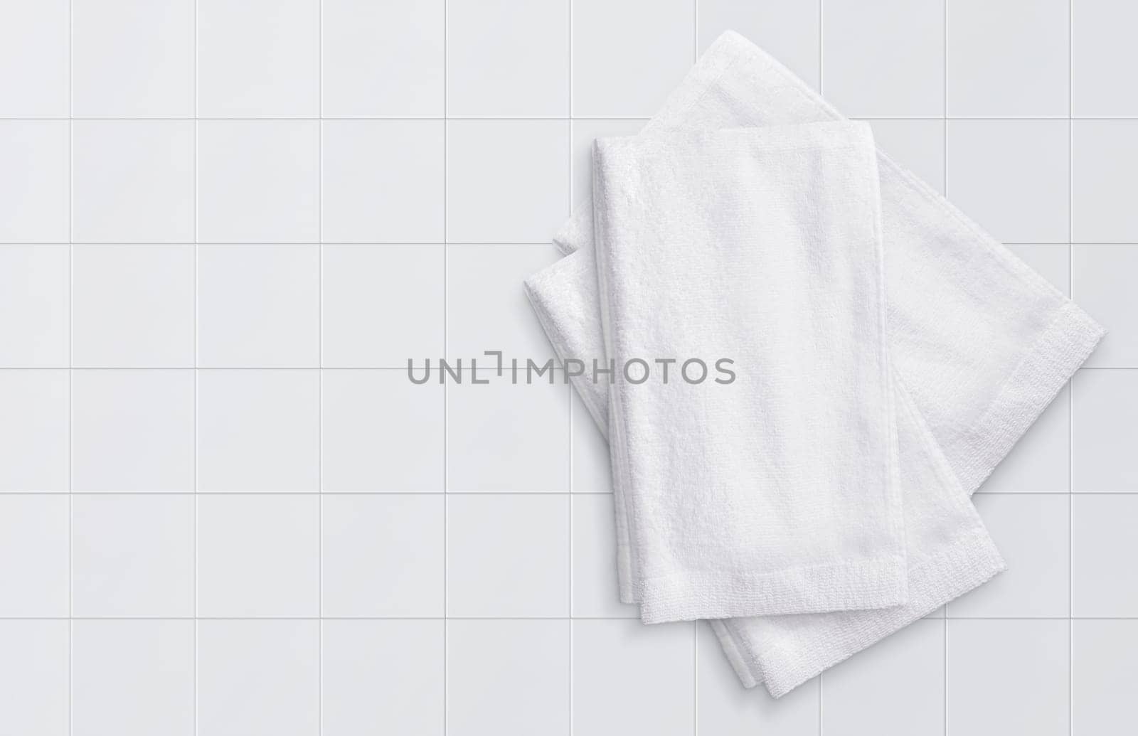 white towel on white tile