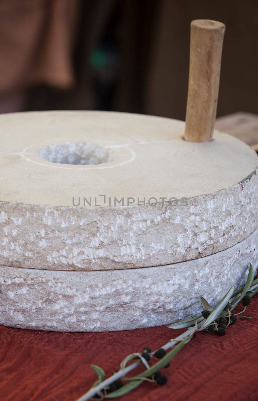 Hand mill stone or mola manuaria, portable mill used in ancient roman times