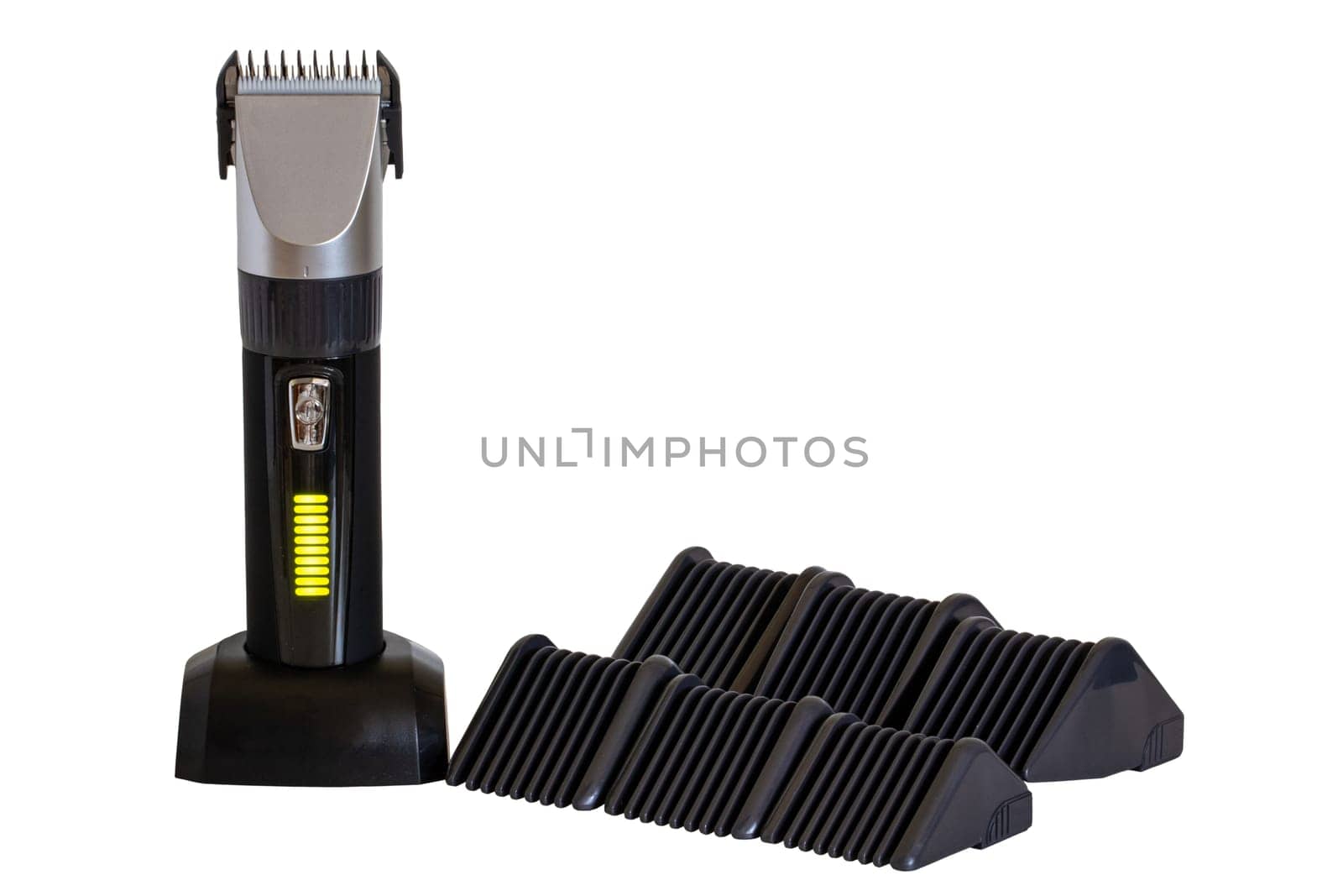 Close-up of a new black silver rechargeable beard and hair clipper with various attachment object isolated. Clipping path. Cordless hair and beard trimmer. Macro.