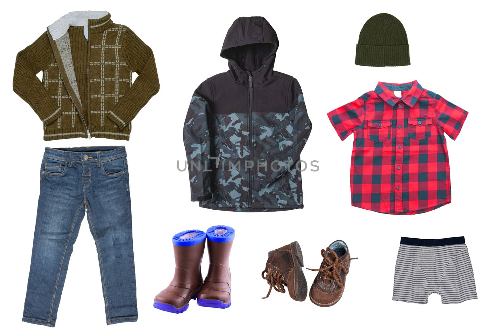Collage set of little boys autumn clothes isolated on a white background. Denim trousers and jacket, sneaker, a down jacket, pants and shirts for child boy. Children's winter fashion.