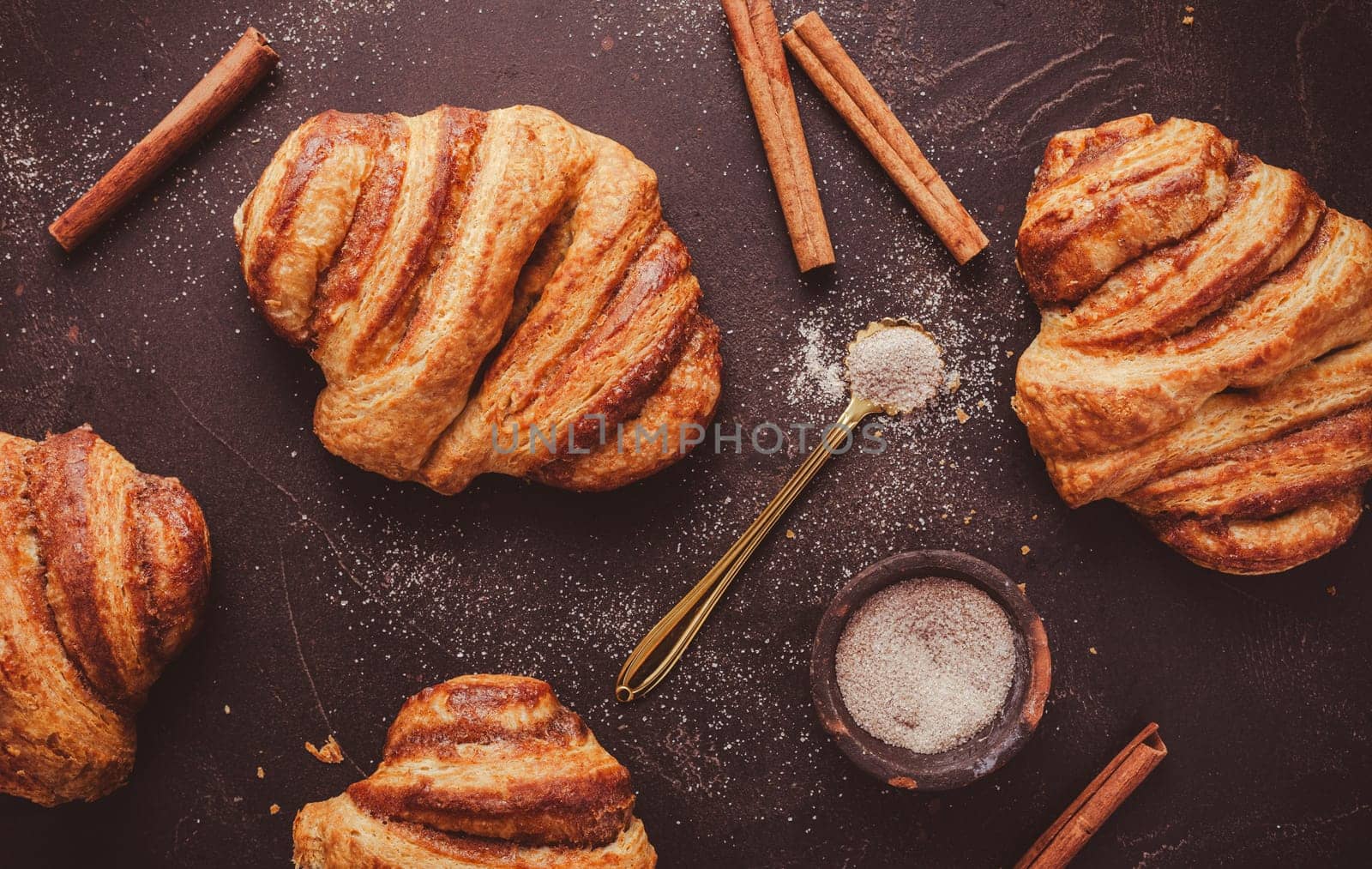 Cinnamon rolls or Franzbroetchen -  Germany sweet pastry sweet pastry baked with butter and cinnamon,  croissant