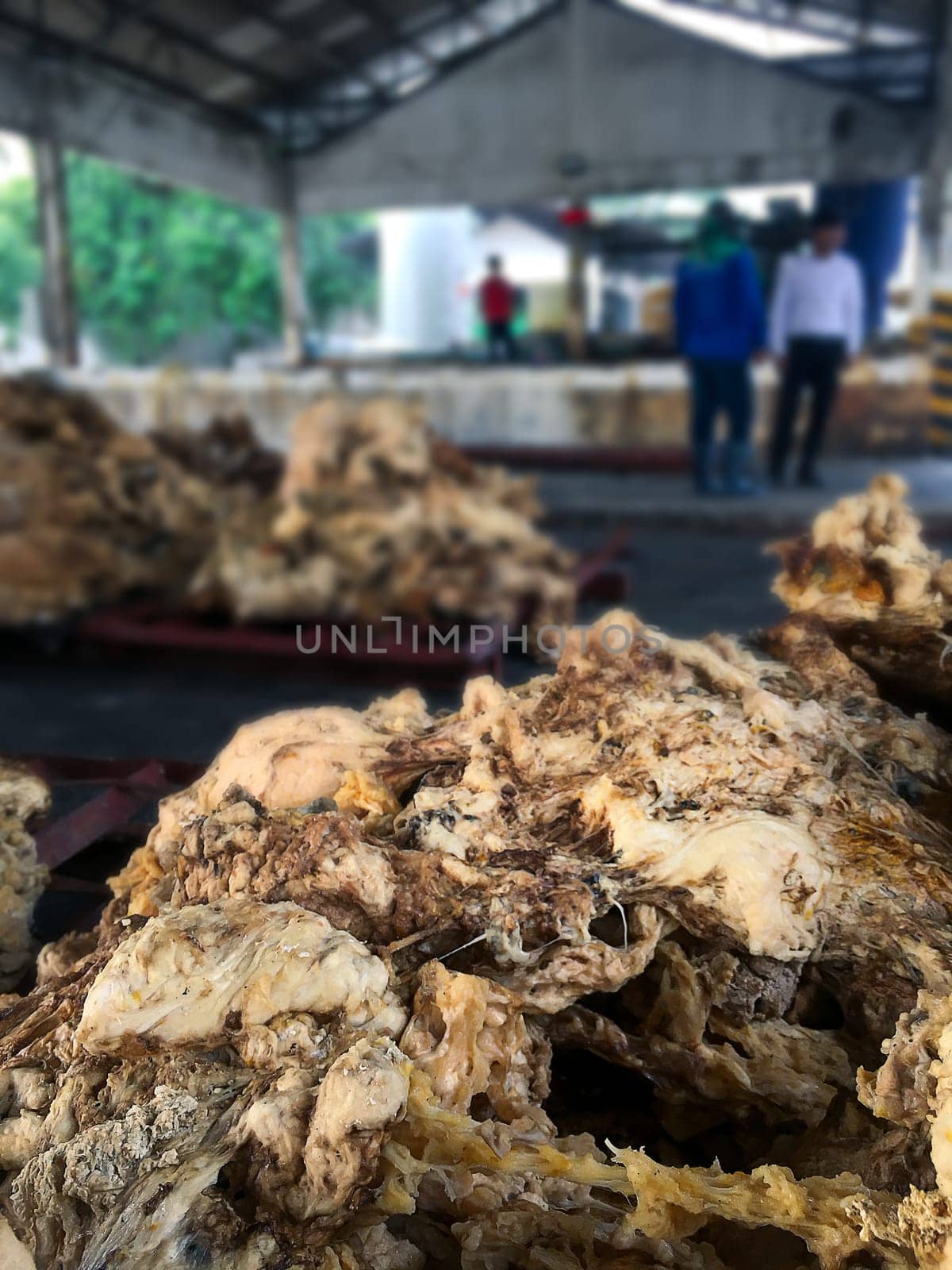 Latex Rubber, Rubber left over from the latex production process to be used to make other materials blurred background